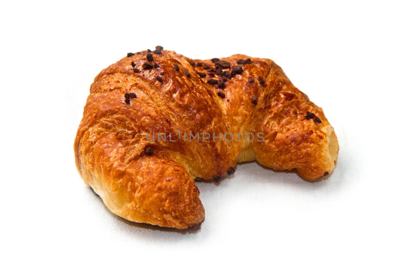 Fresh and tasty croissant on the white 