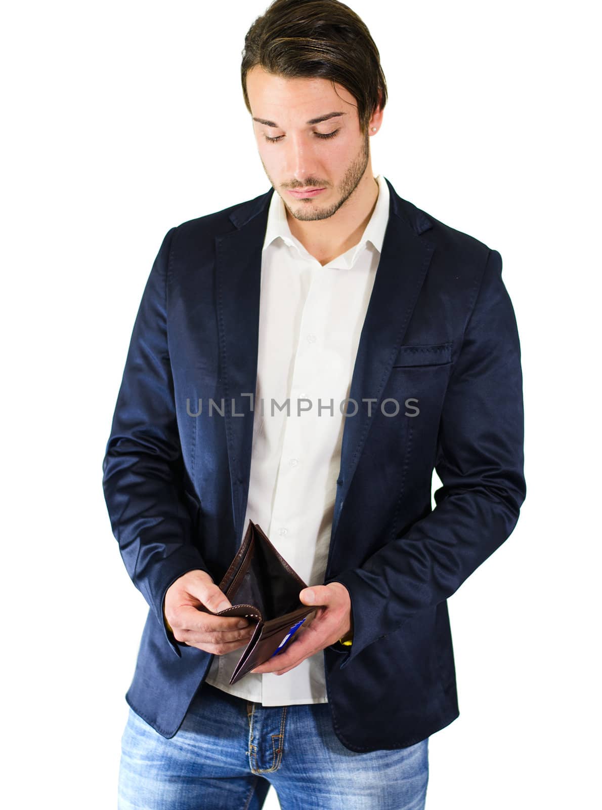 Unhappy, worried guy looking at empty wallet by artofphoto