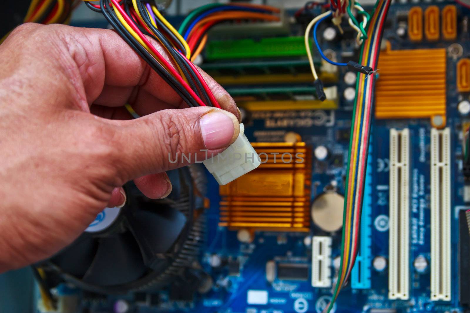 Technician repairing computer hardware in the lab by wasan_gredpree