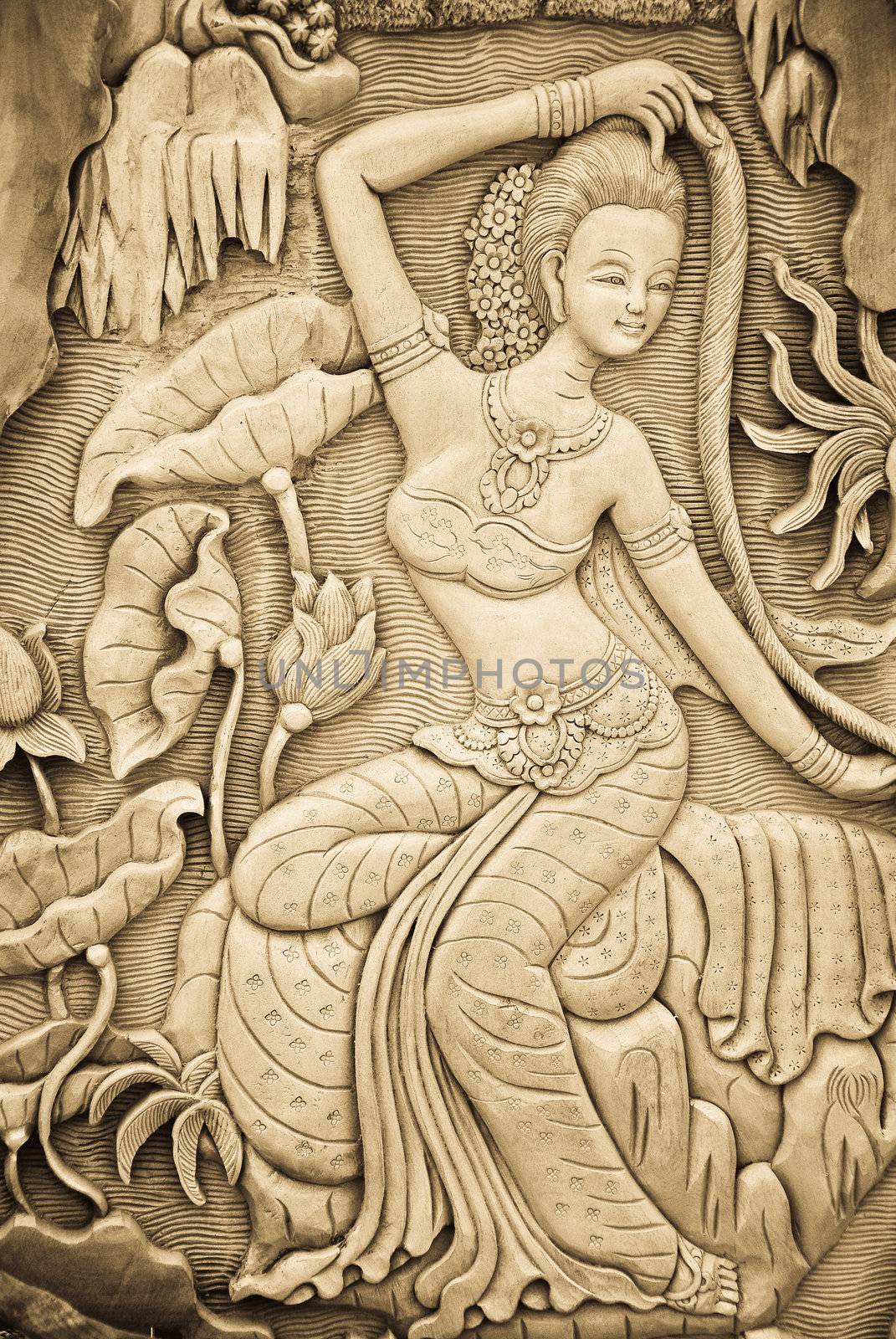 Carved woman on the wall