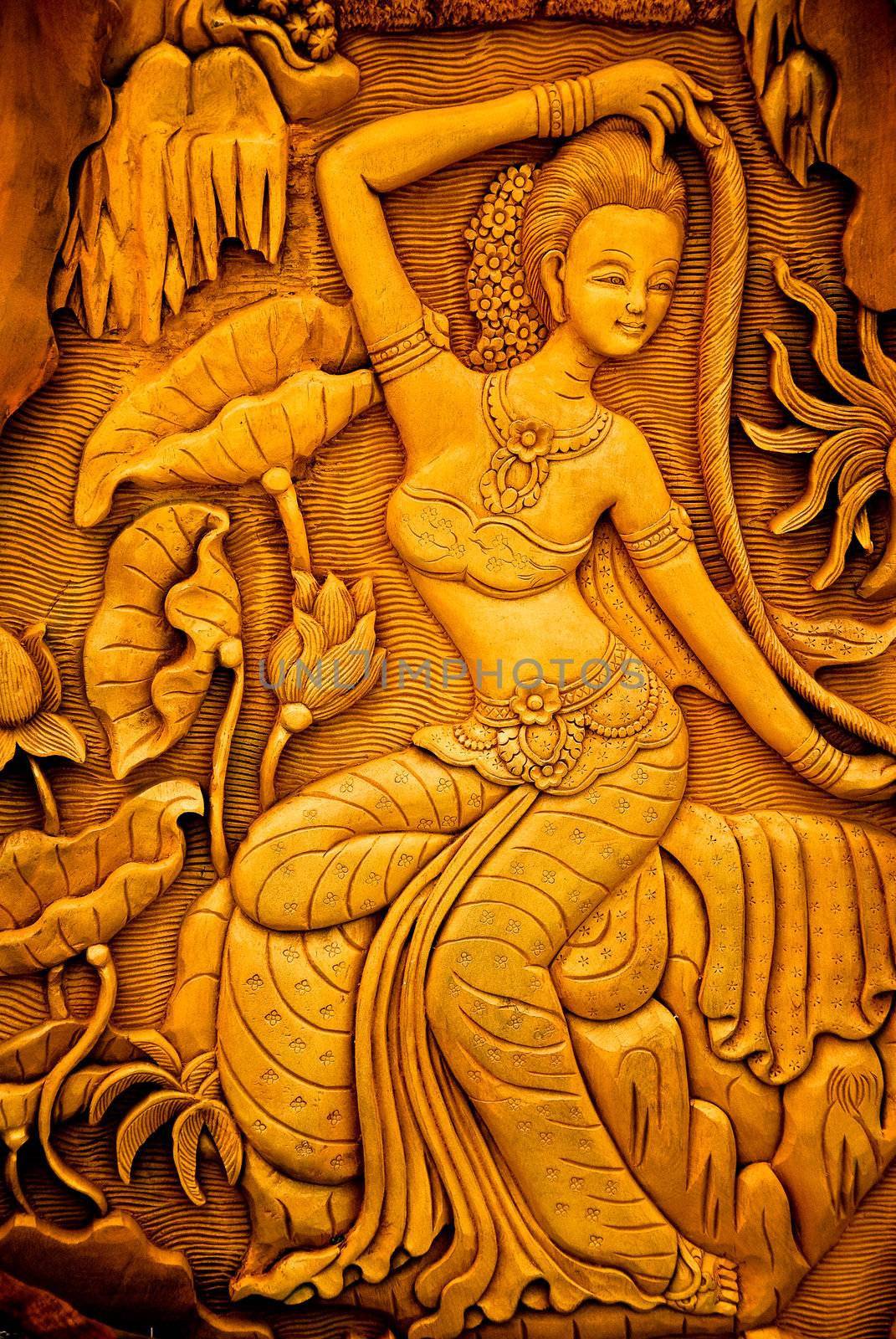Carved woman on the wall
