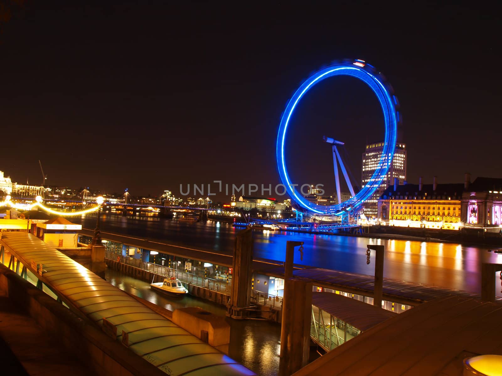 LONDON - March 18th 2011: Night view of The London Eye ,  in London, England. At a height of 135m, it is the tallest Ferris wheel in Europe.