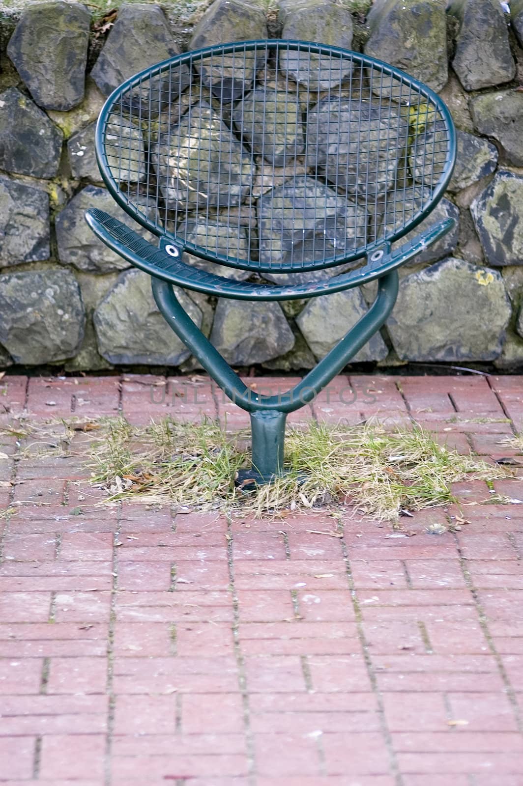 Single iron chair in park