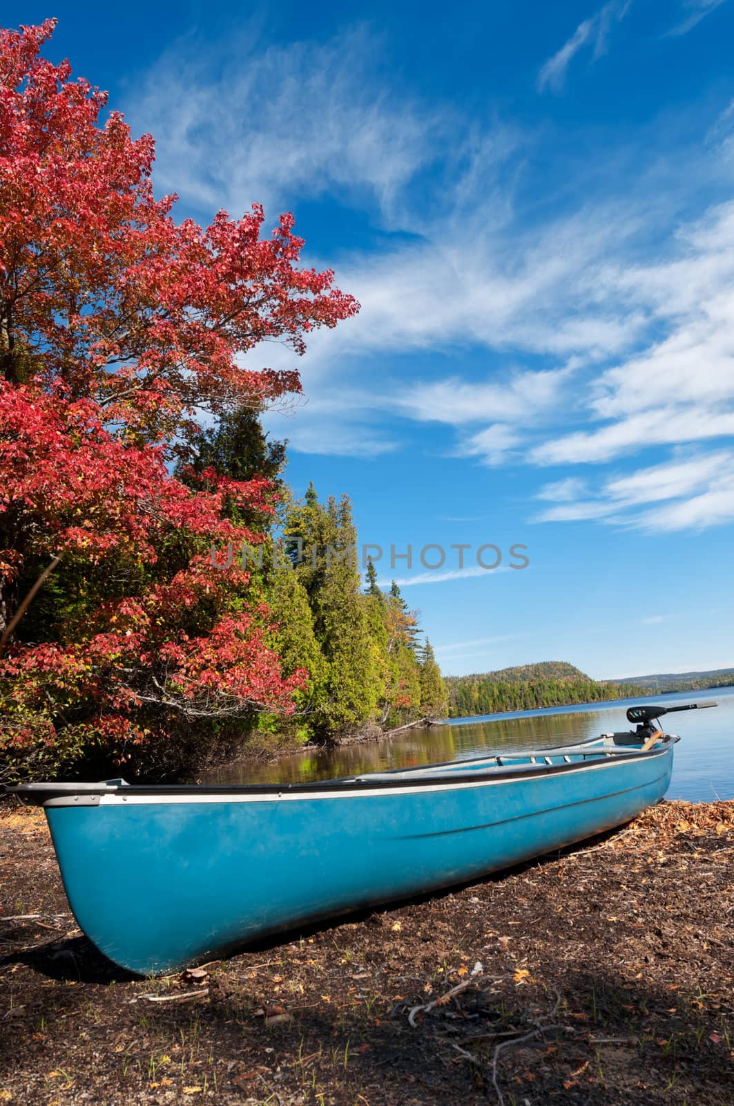 Kayak, Boat during sunny day at a lake with blue sky