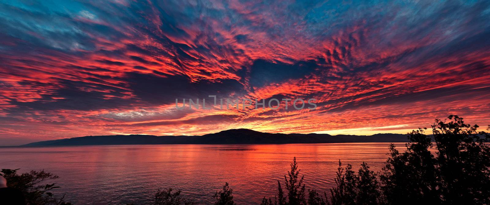 Sea at sunset, sky is in beautiful dramatic color by 3523Studio