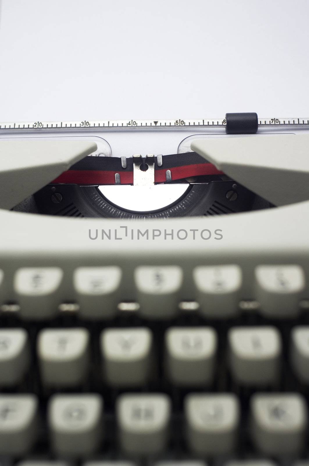 a close up of typewriter, focus on paper where message will be typed.