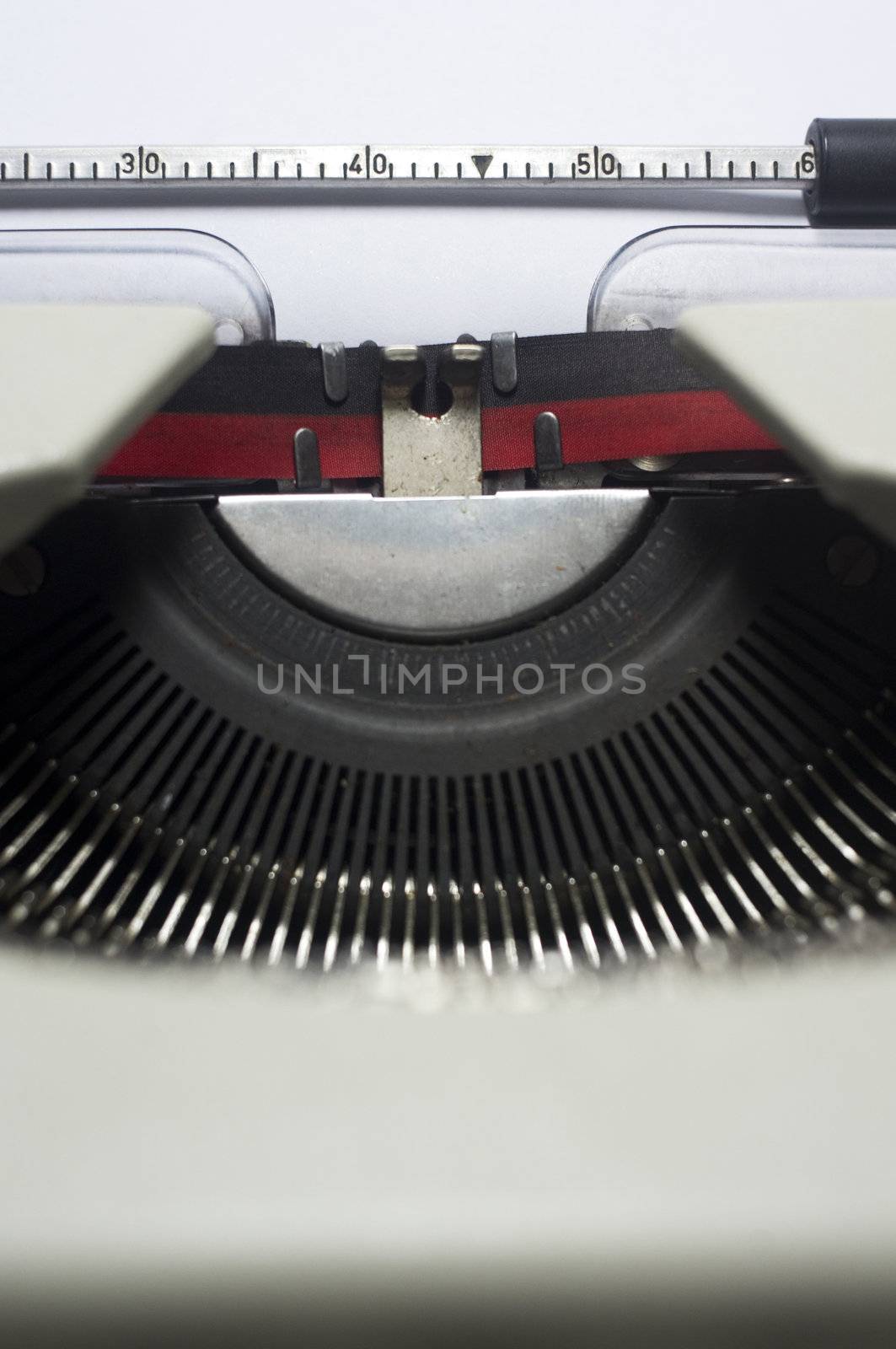 a close up of typewriter, focus on paper where message will be typed.