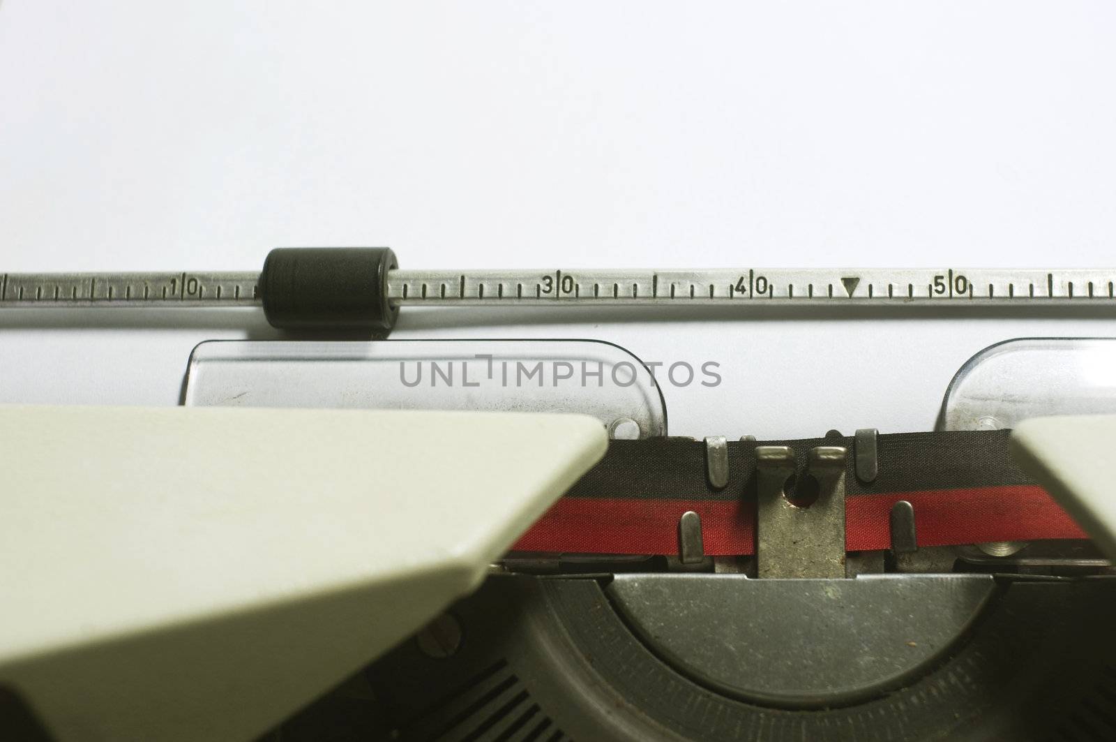 a close up of typewriter, focus on paper where message will be typed.