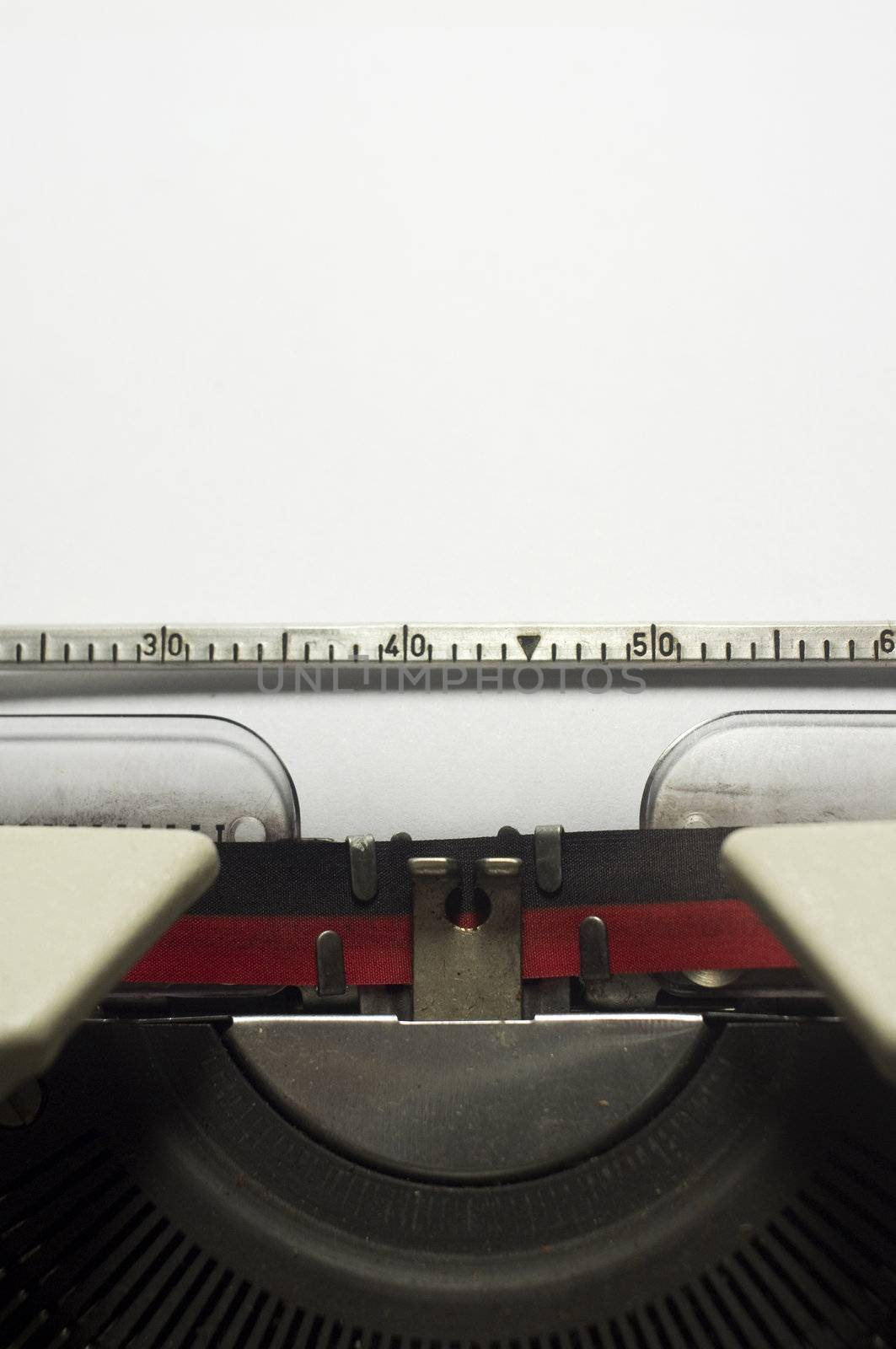 a close up of typewriter, focus on paper where message will be typed.