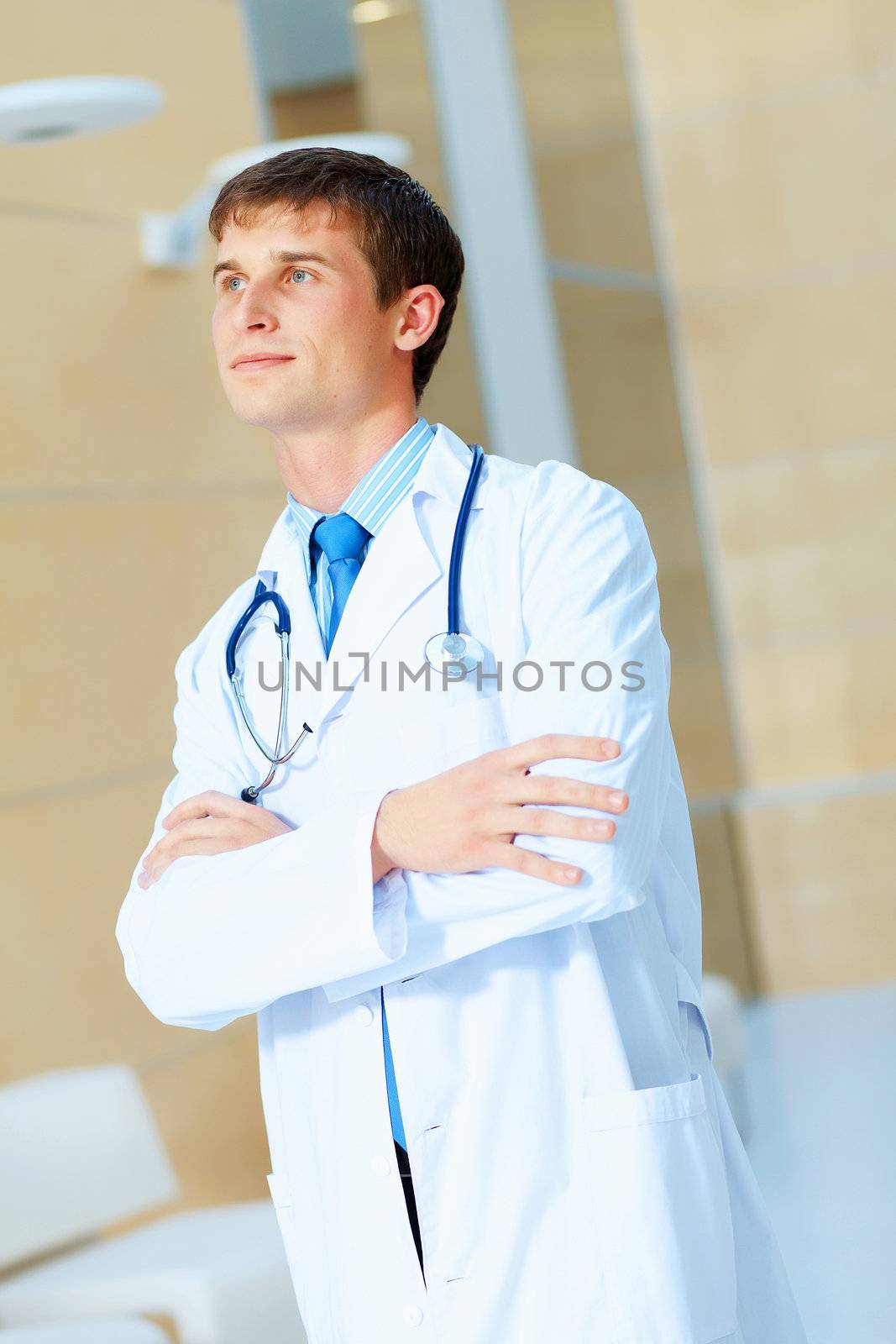 Portrait of friendly male doctor in hospital smiling