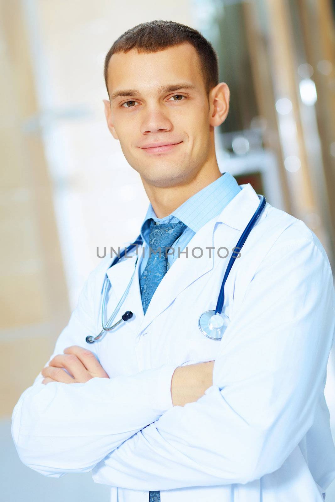 Portrait of friendly male doctor in hospital smiling