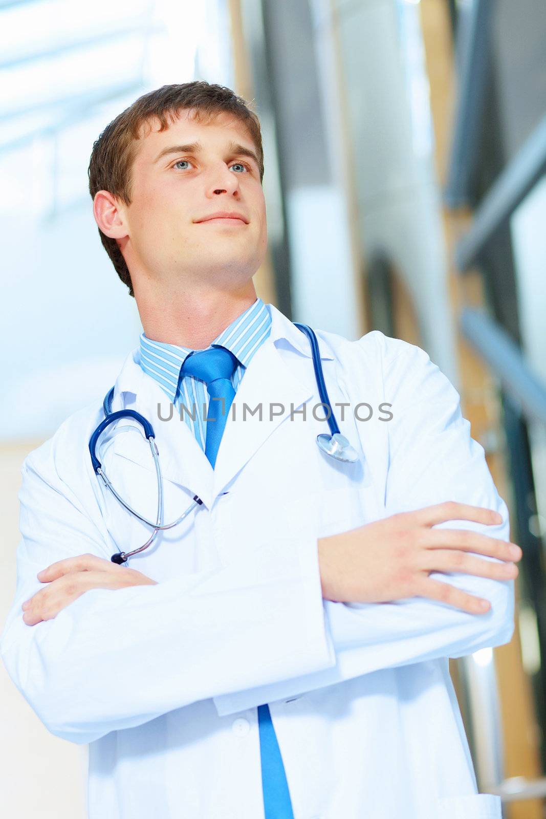 Portrait of friendly male doctor in hospital smiling