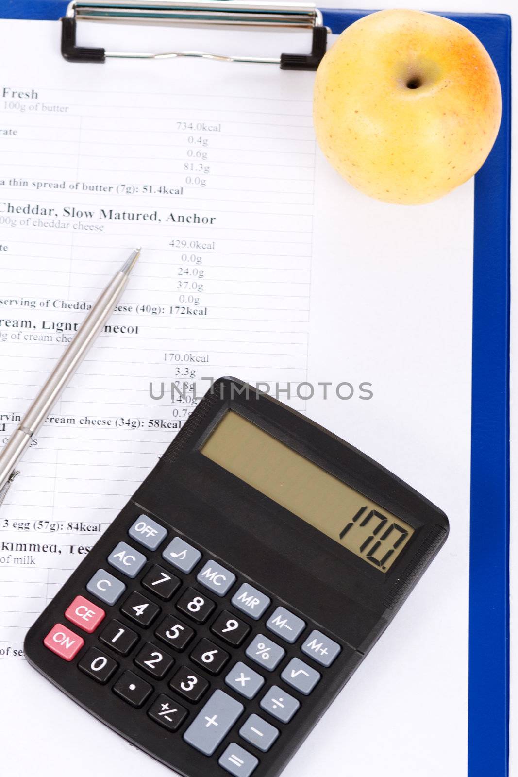 Table of calories, an apple and a calculator