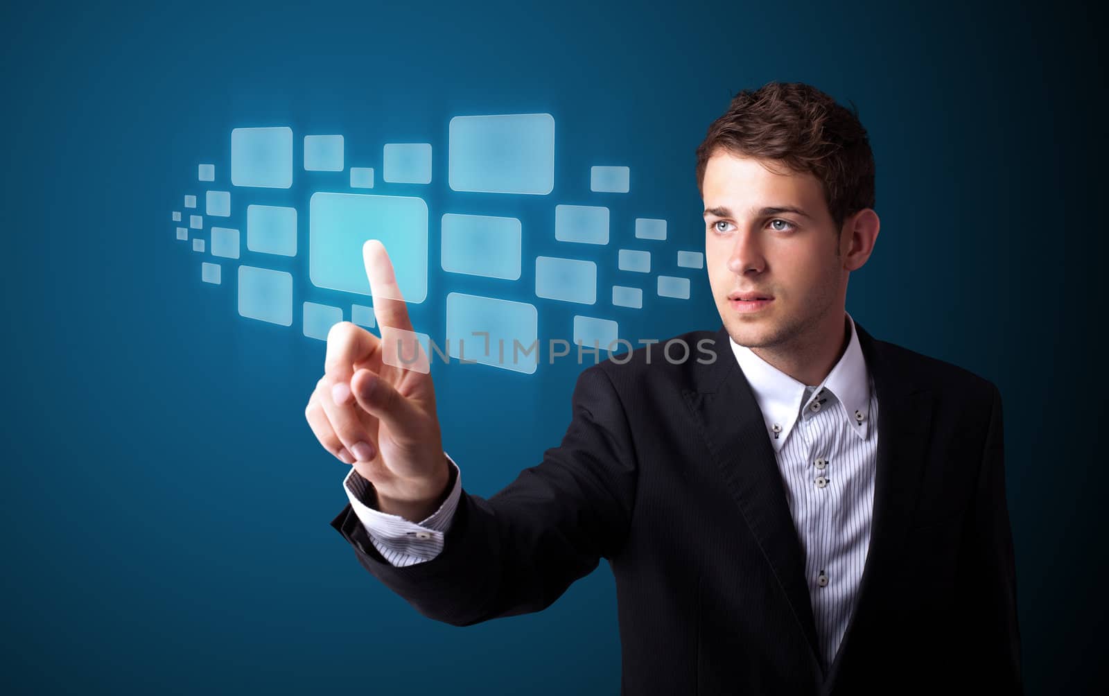 Businessman pressing high tech type of modern buttons on a virtual background