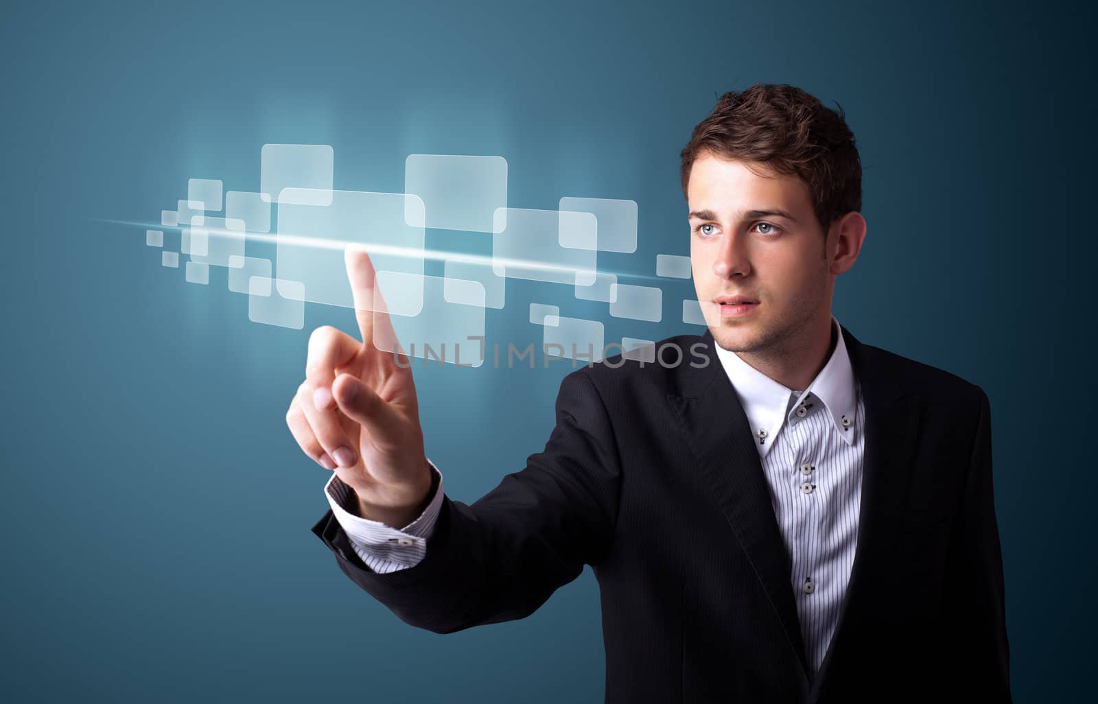 Businessman pressing high tech type of modern buttons on a virtual background