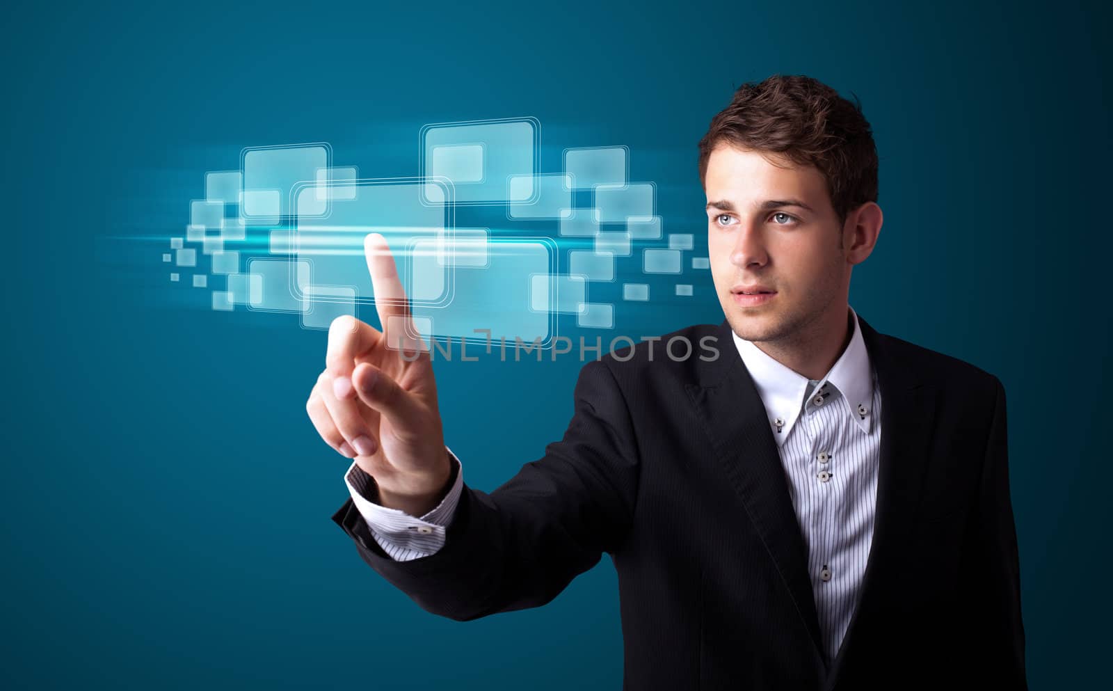 Businessman pressing high tech type of modern buttons on a virtual background
