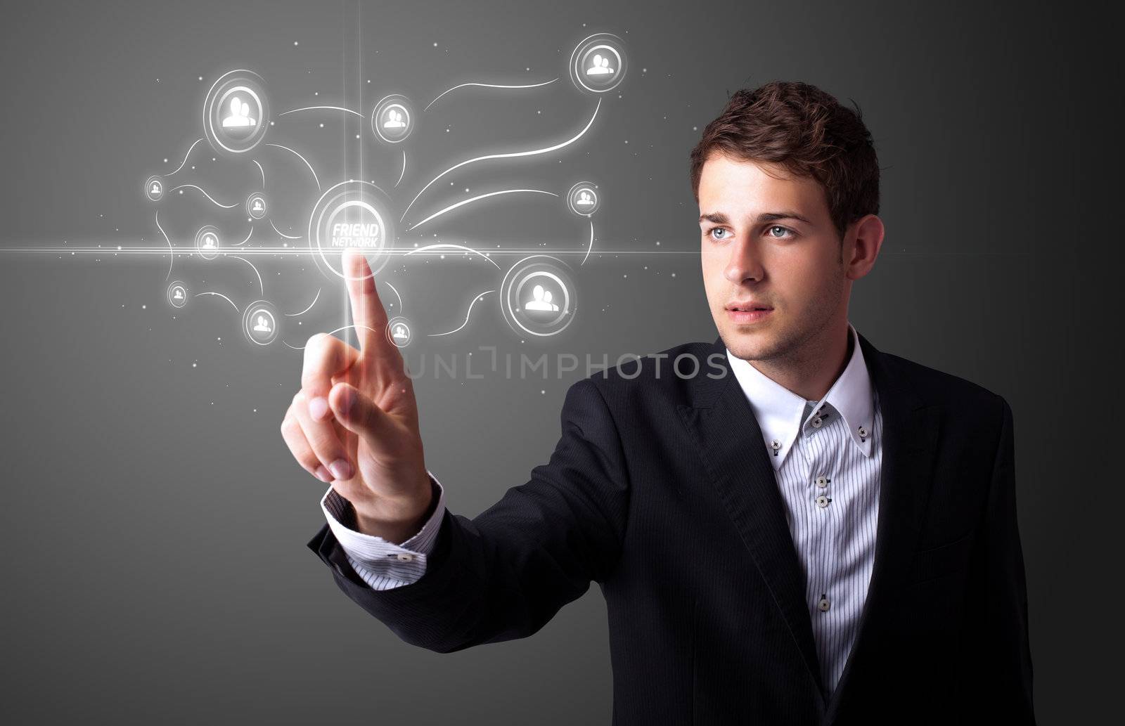 Businessman pressing modern social buttons on a virtual background