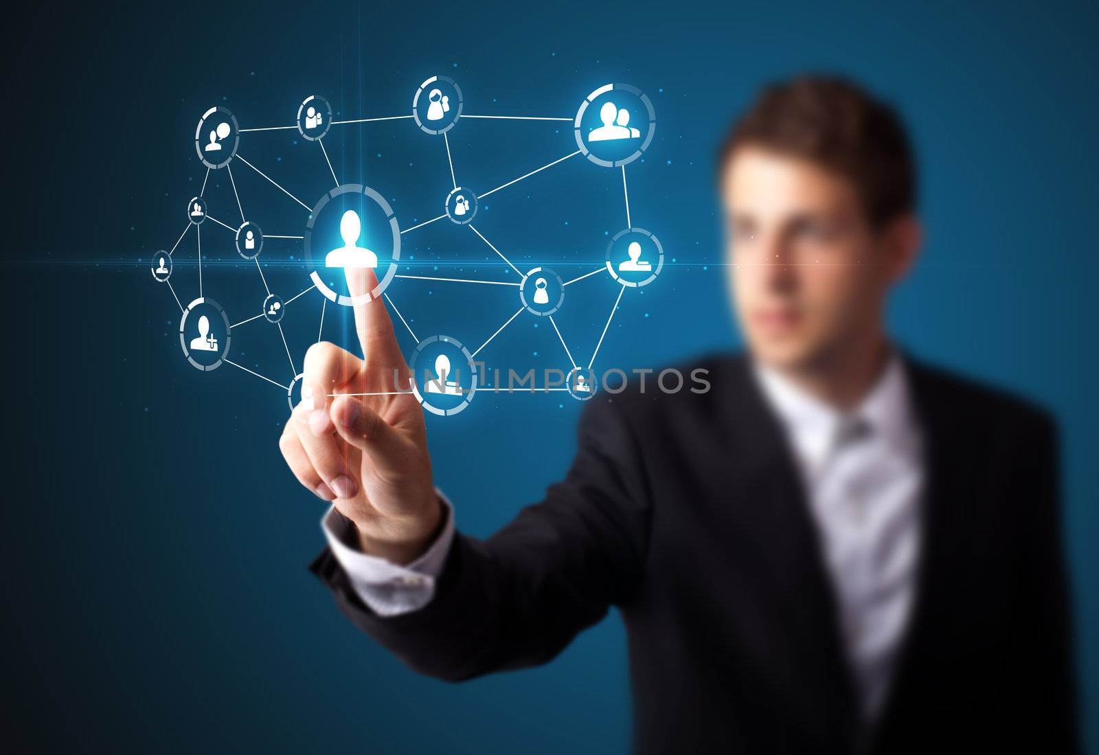 Businessman pressing modern social buttons on a virtual background