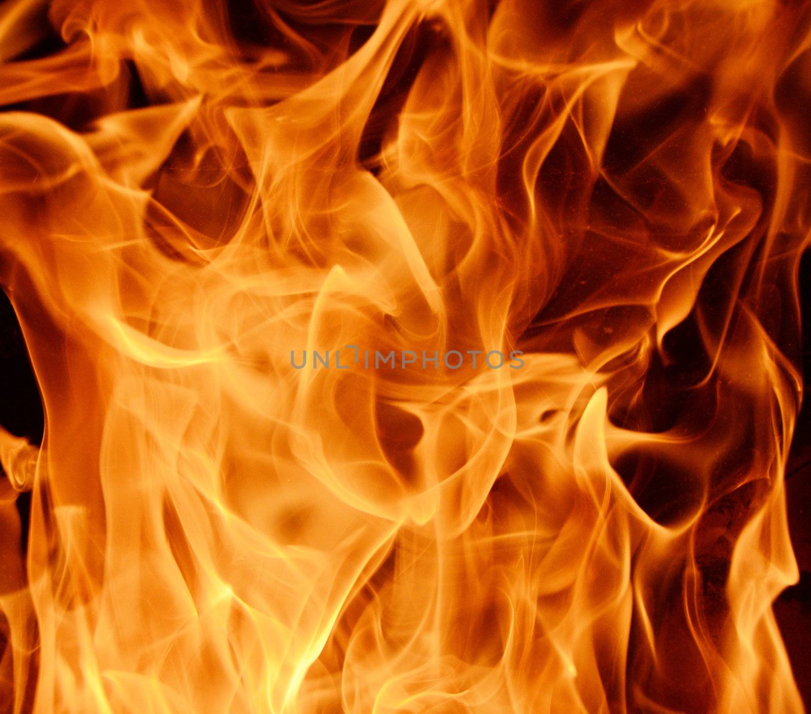 Abstract background / backdrop representing fire. flame pattern with dark and light spots. Can be used as a wallpaper