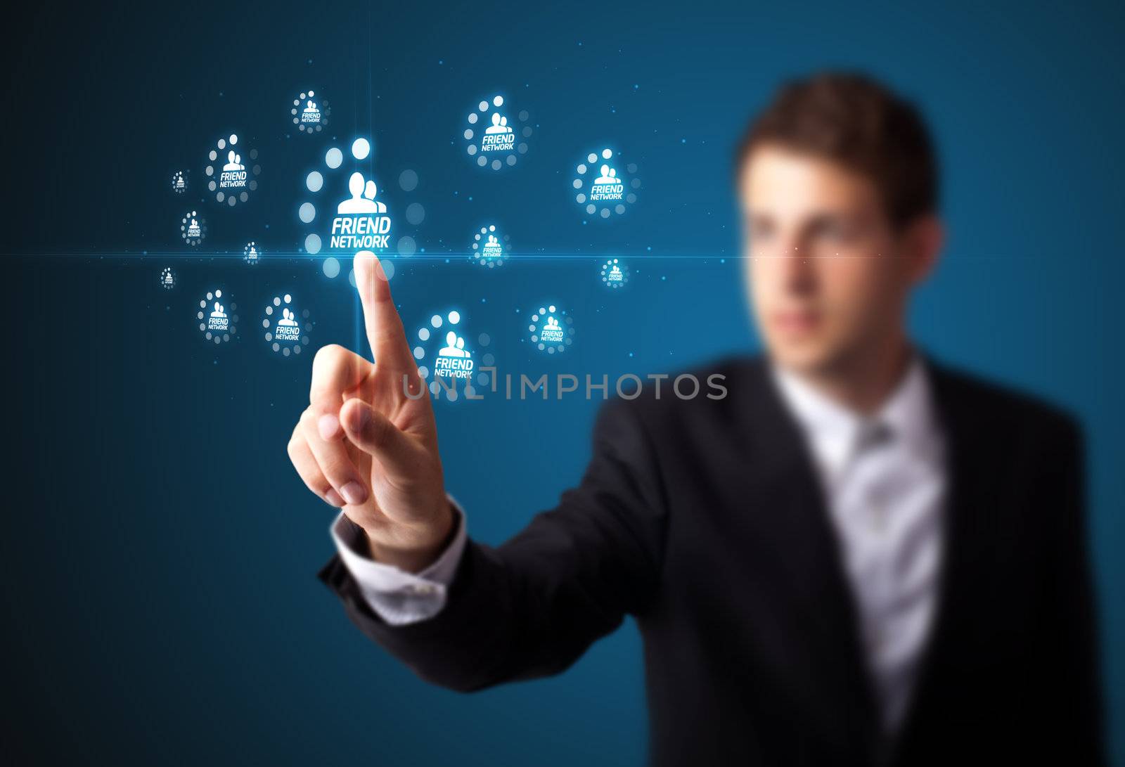 Businessman pressing modern social buttons on a virtual background