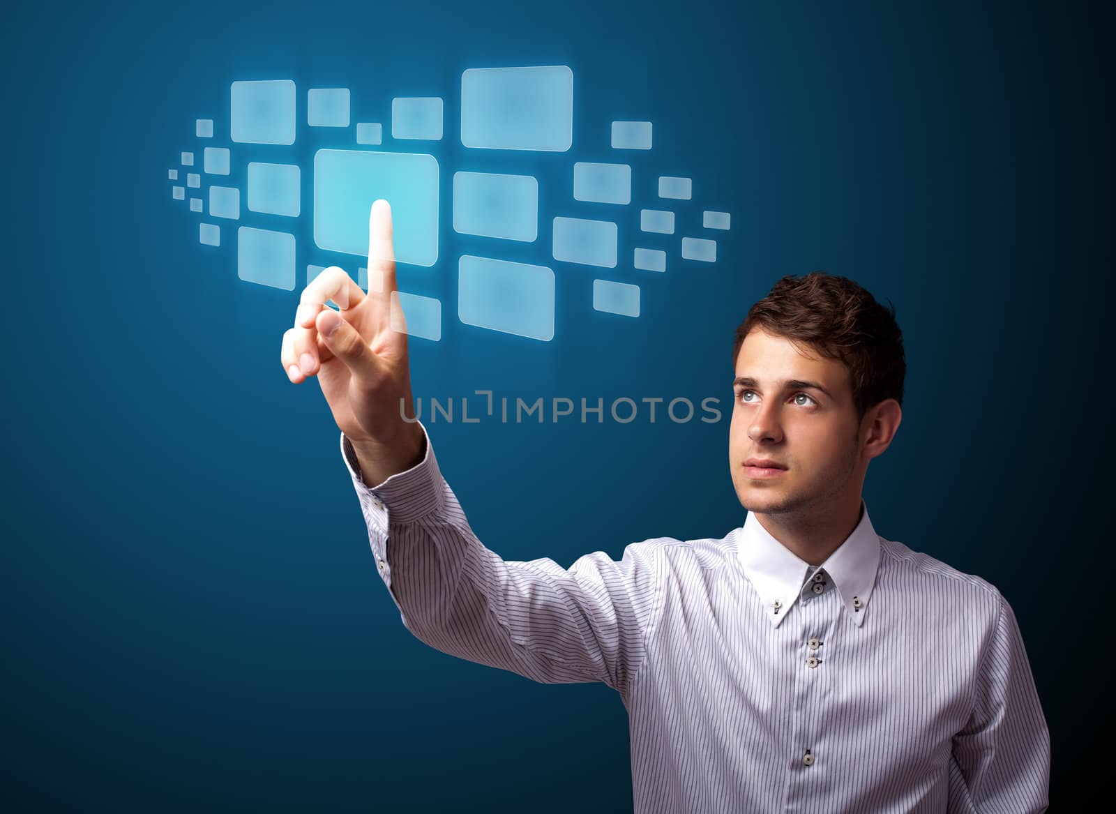 Businessman pressing high tech type of modern buttons on a virtual background