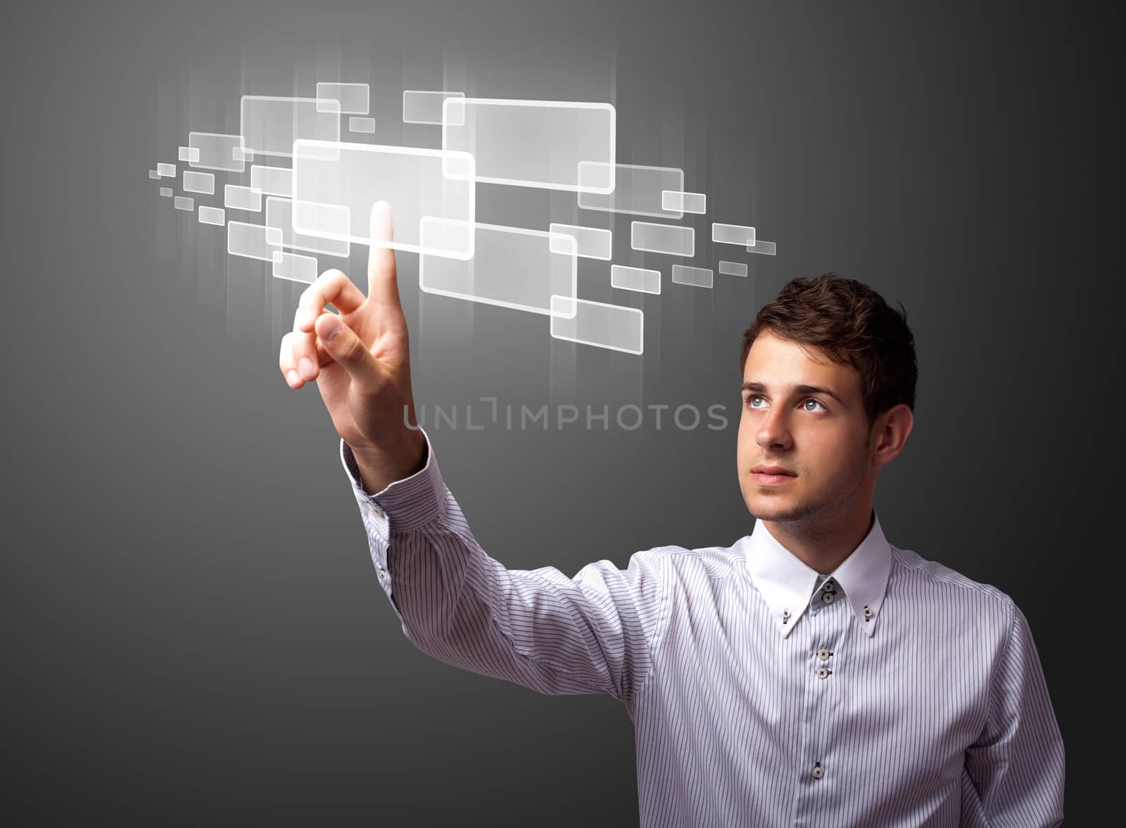 Businessman pressing high tech type of modern buttons on a virtual background