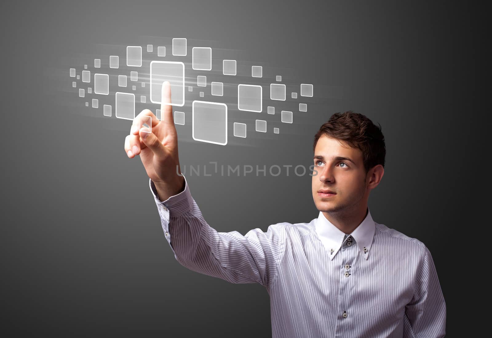 Businessman pressing high tech type of modern buttons on a virtual background