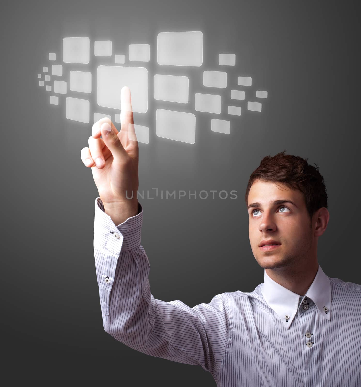 Businessman pressing high tech type of modern buttons on a virtual background