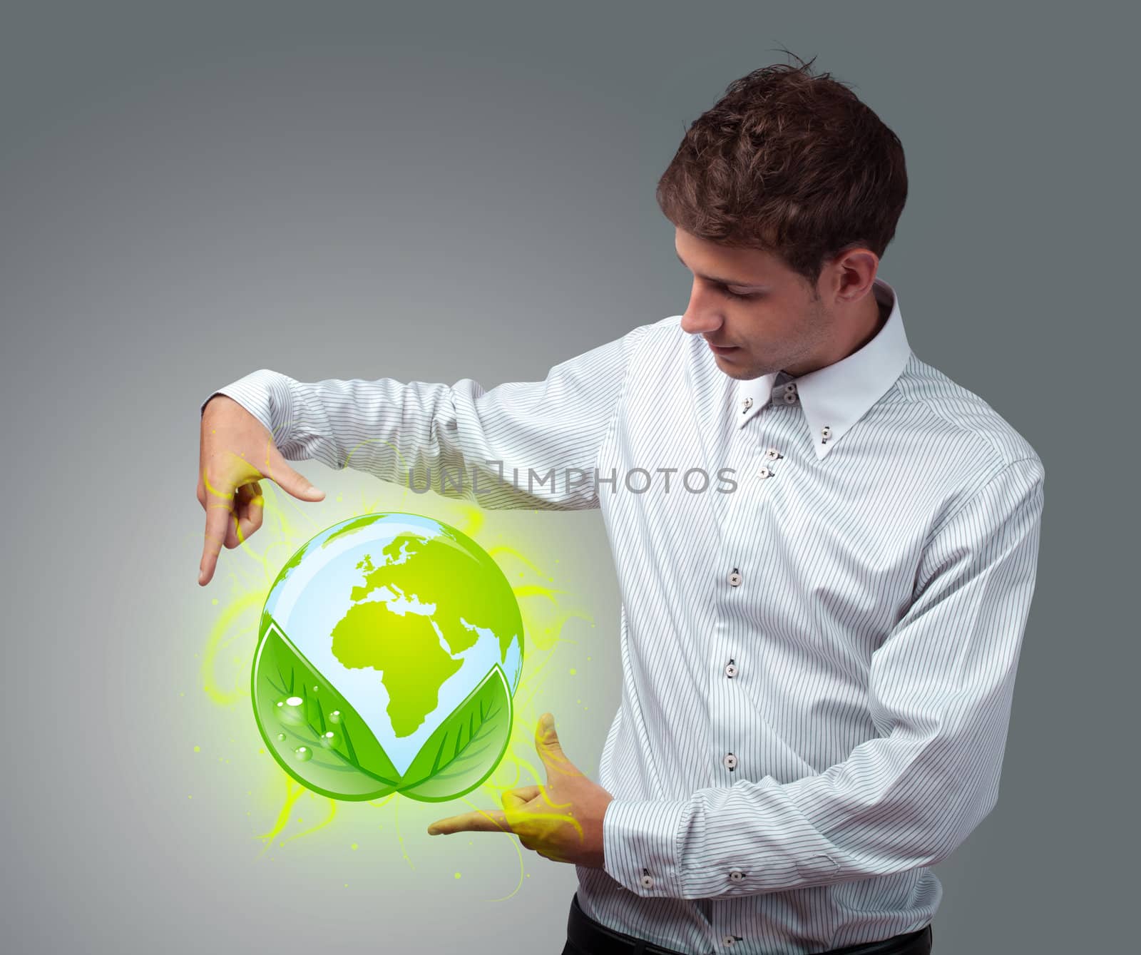 Young businessman holding virtual eco sign