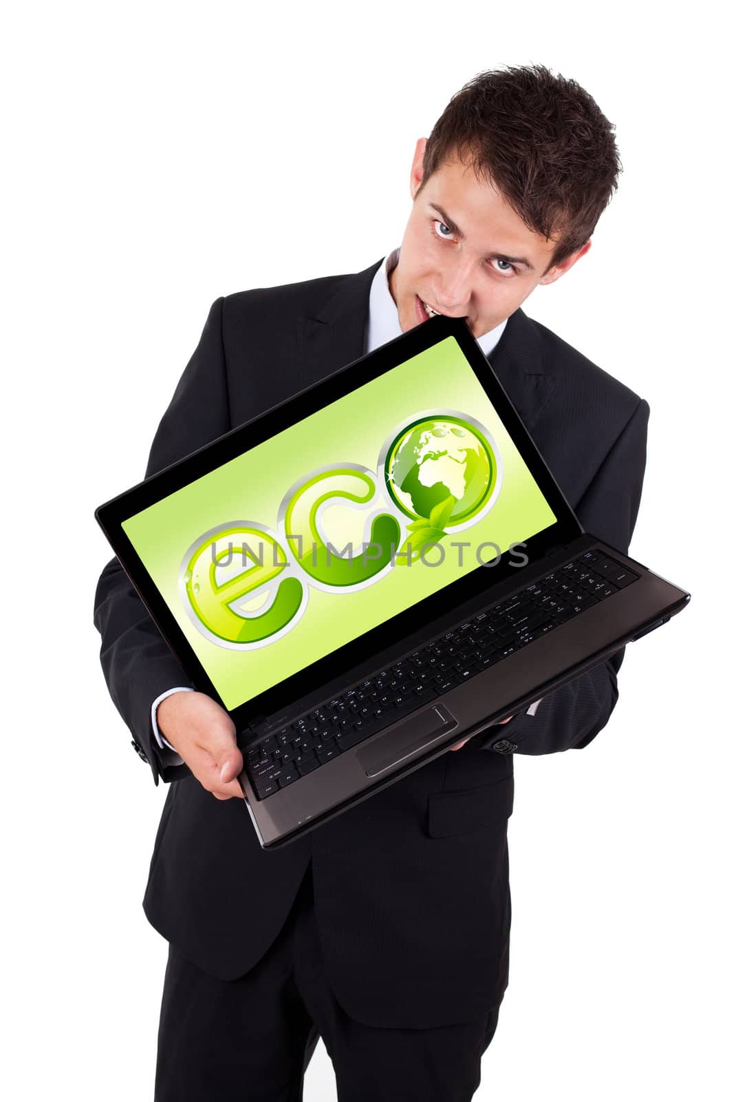 A businessman bites a laptop with eco sign, isolated on white