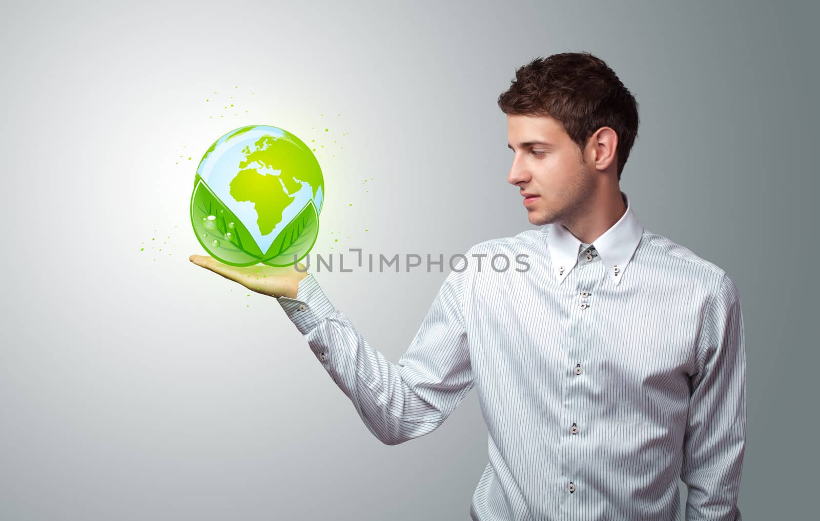  businessman holding virtual eco sign by ra2studio