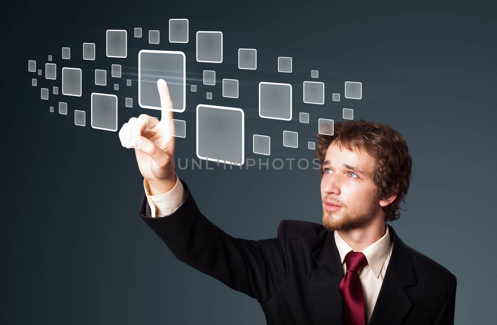 Businessman pressing high tech type of modern buttons on a virtual background