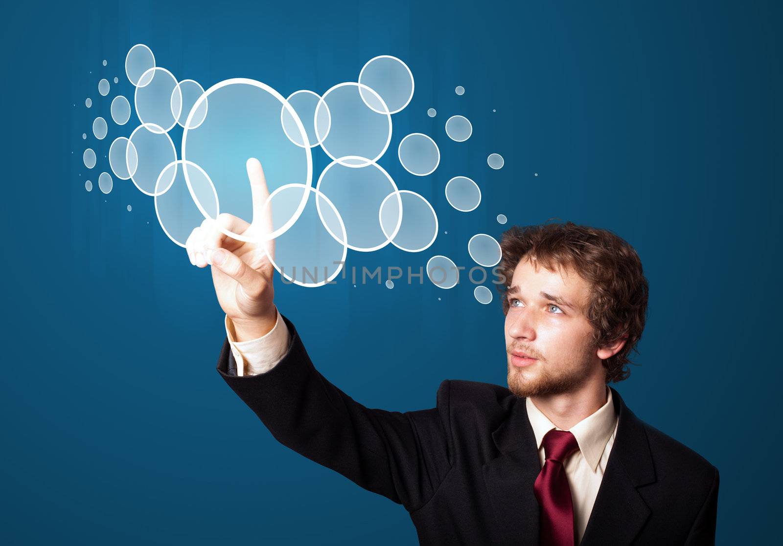 Businessman pressing high tech type of modern buttons on a virtual background