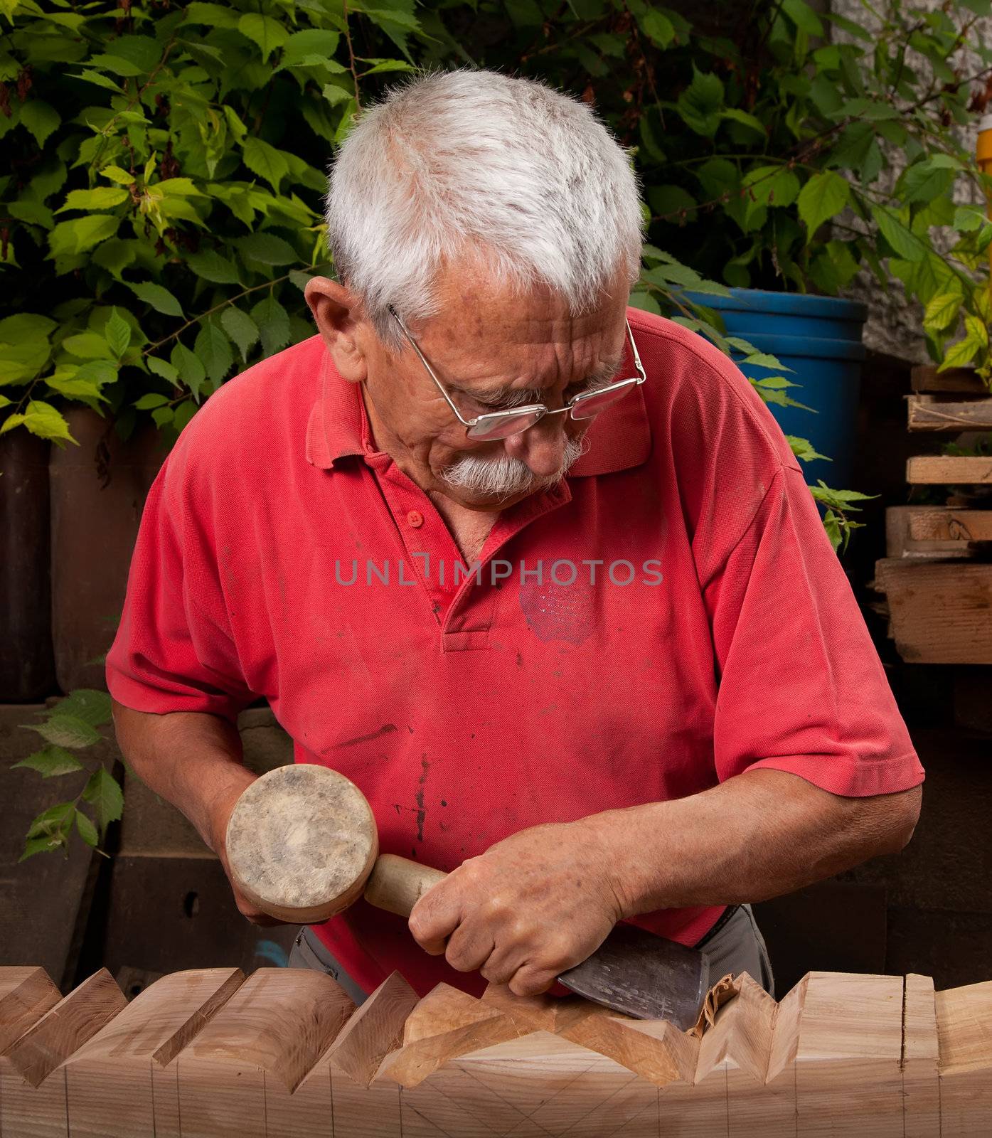 woodcarver working with mallet and chisel 10 by ra2studio