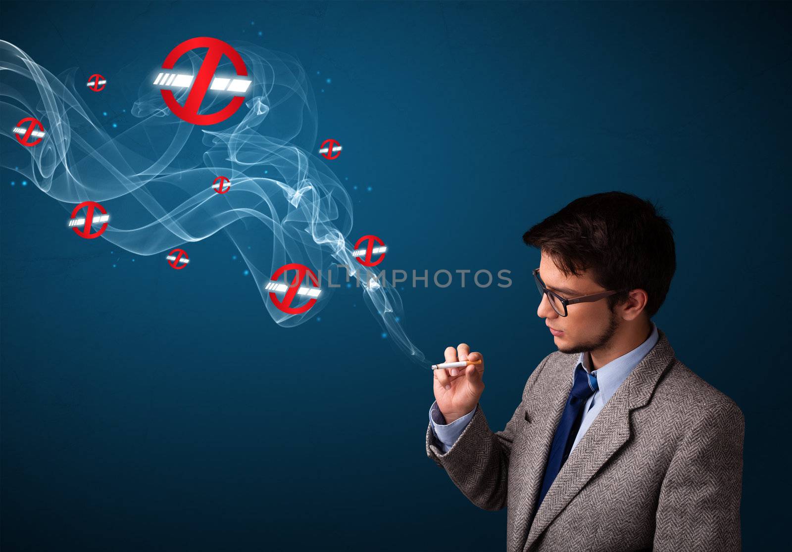 Attractive young man smoking dangerous cigarette with no smoking signs