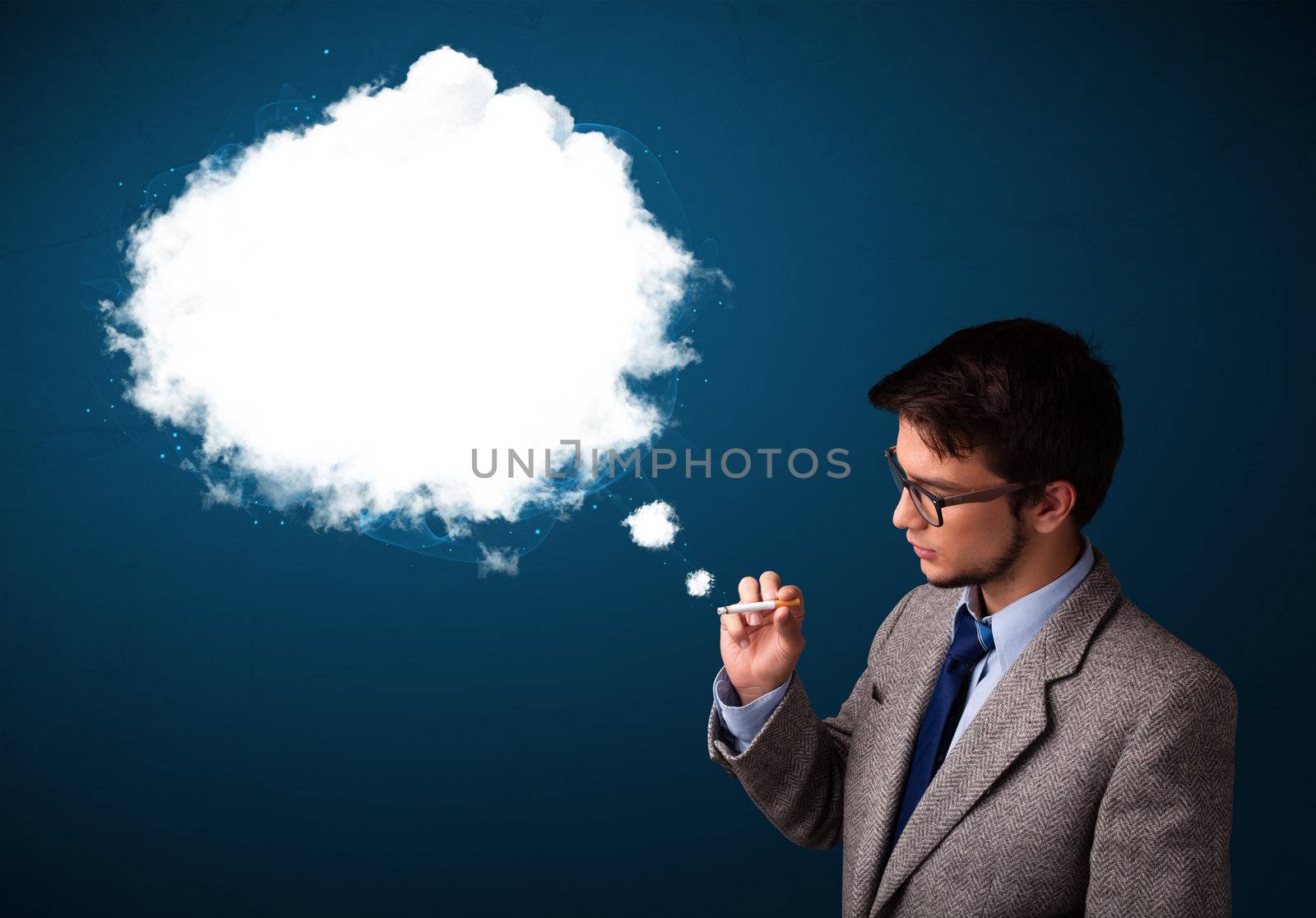 Handsome young man smoking unhealthy cigarette with dense smoke