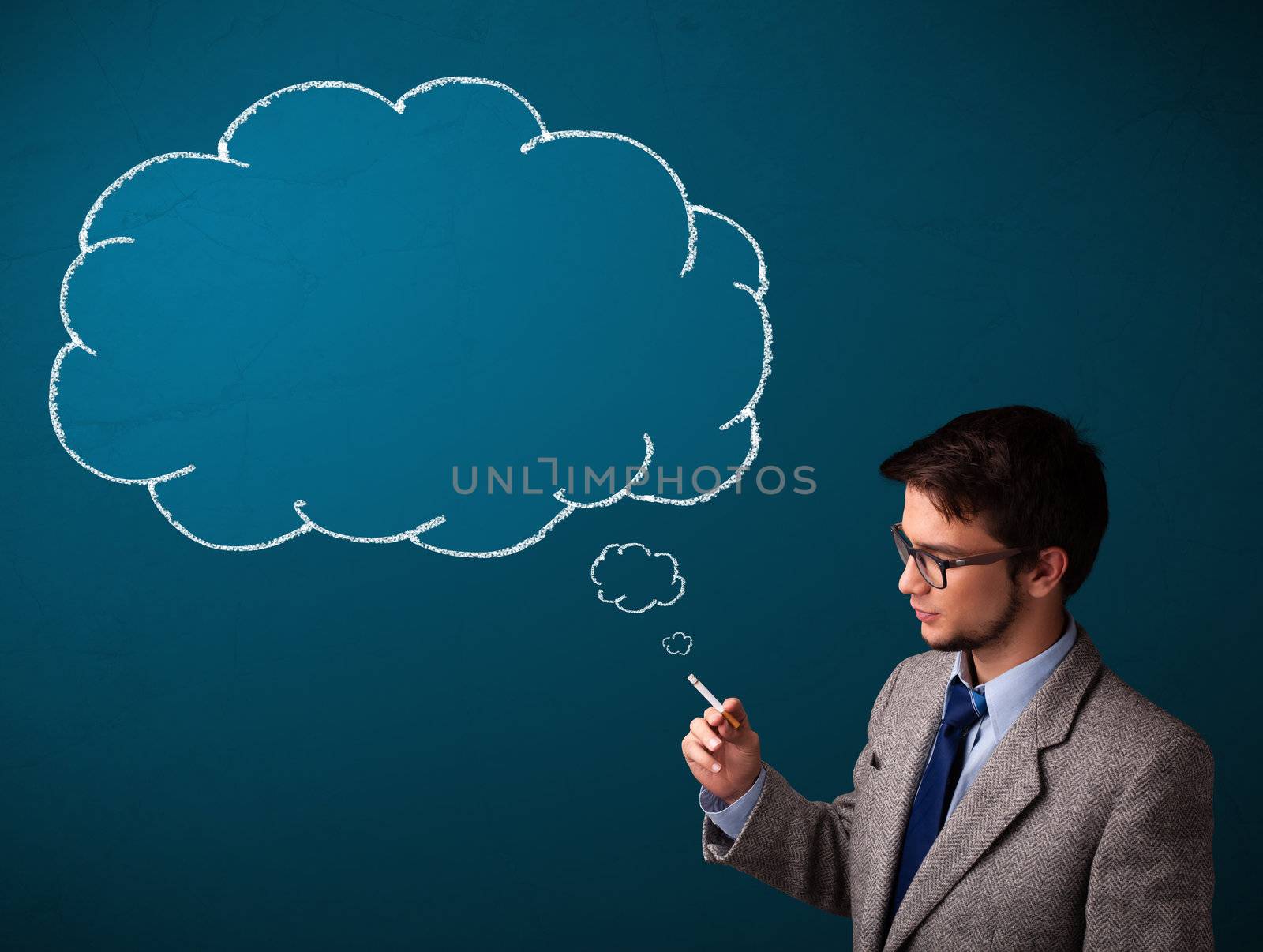 Attractive young man smoking cigarette with idea cloud