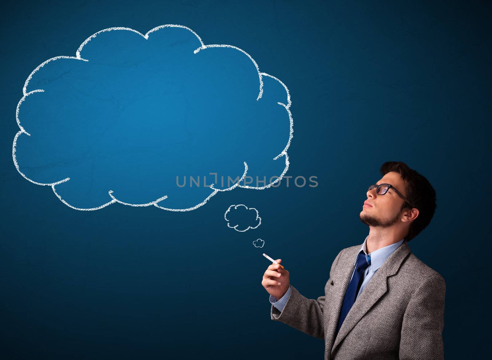 Attractive young man smoking cigarette with idea cloud