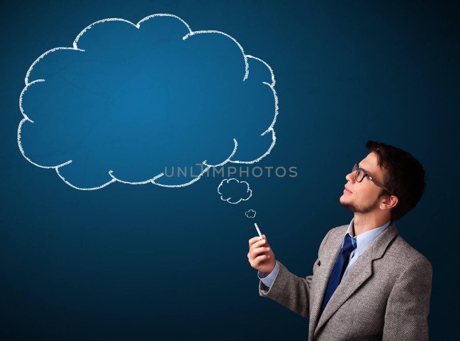 Attractive young man smoking cigarette with idea cloud