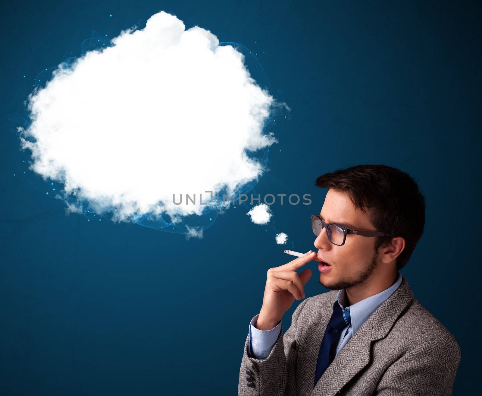 Handsome young man smoking unhealthy cigarette with dense smoke