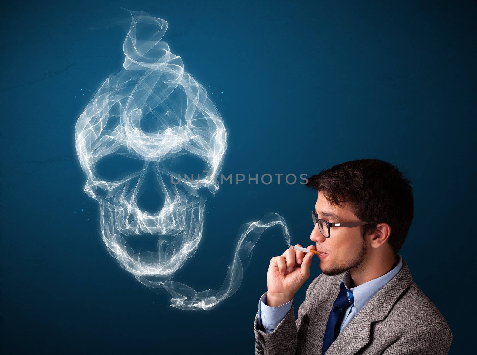 Handsome young man smoking dangerous cigarette with toxic skull smoke 