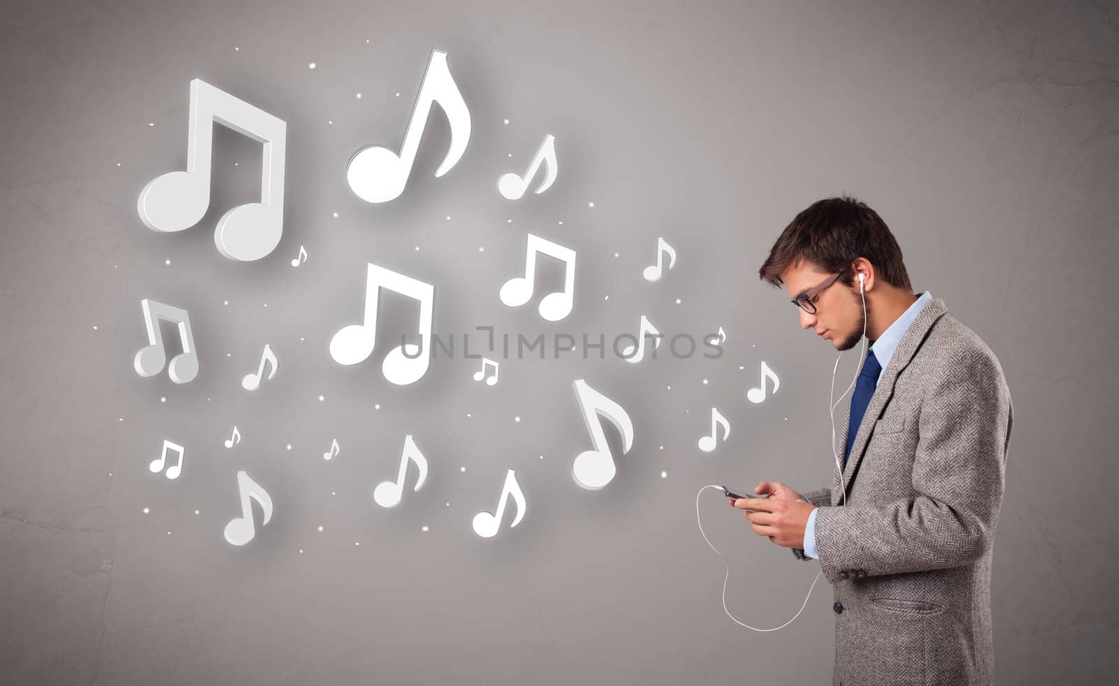 attractive young man singing and listening to music with musical notes getting out of his mouth