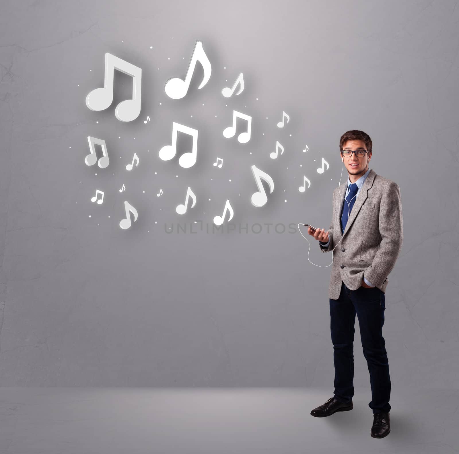 attractive young man singing and listening to music with musical notes getting out of his mouth