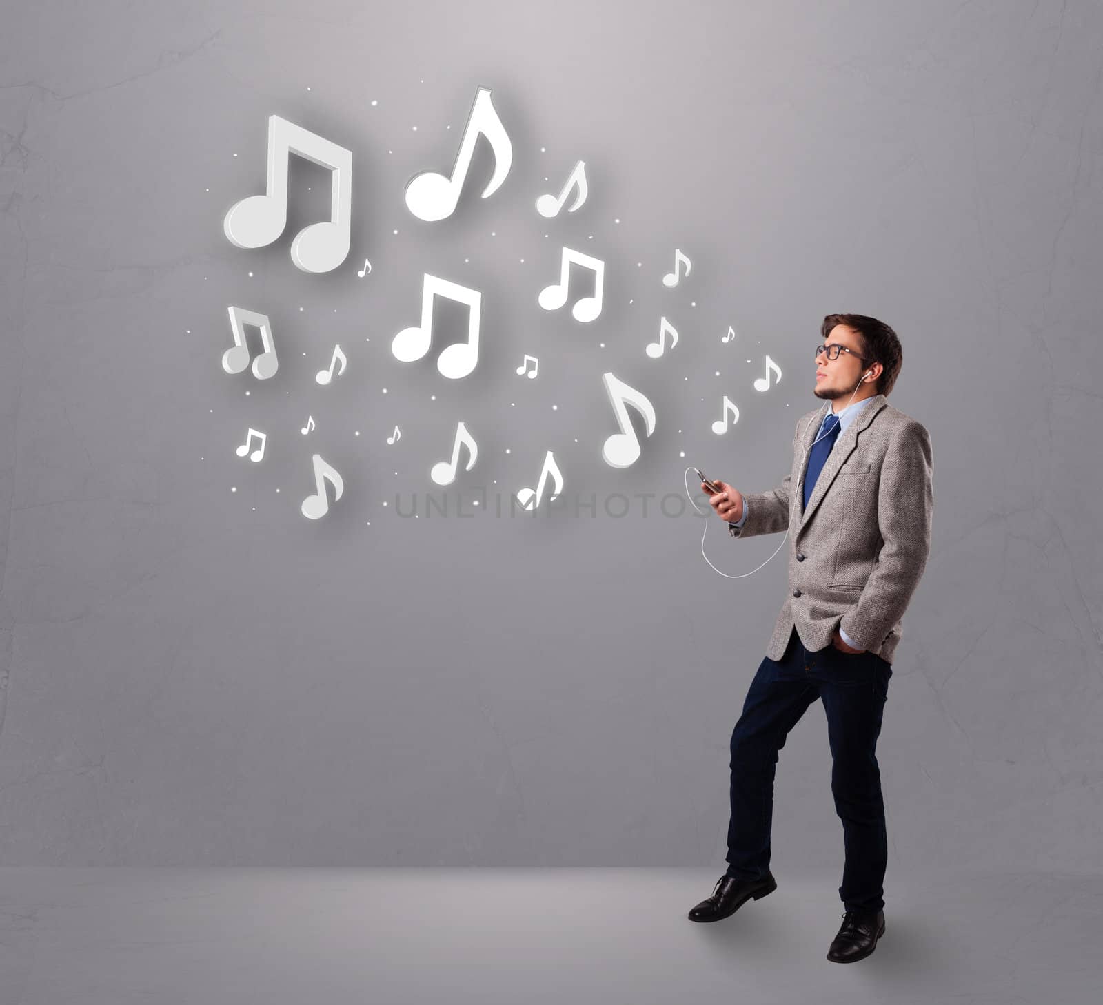 attractive young man singing and listening to music with musical notes getting out of his mouth