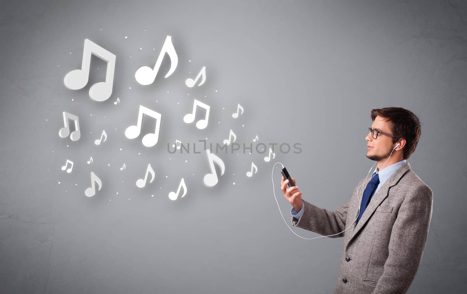 attractive young man singing and listening to music with musical notes getting out of his mouth