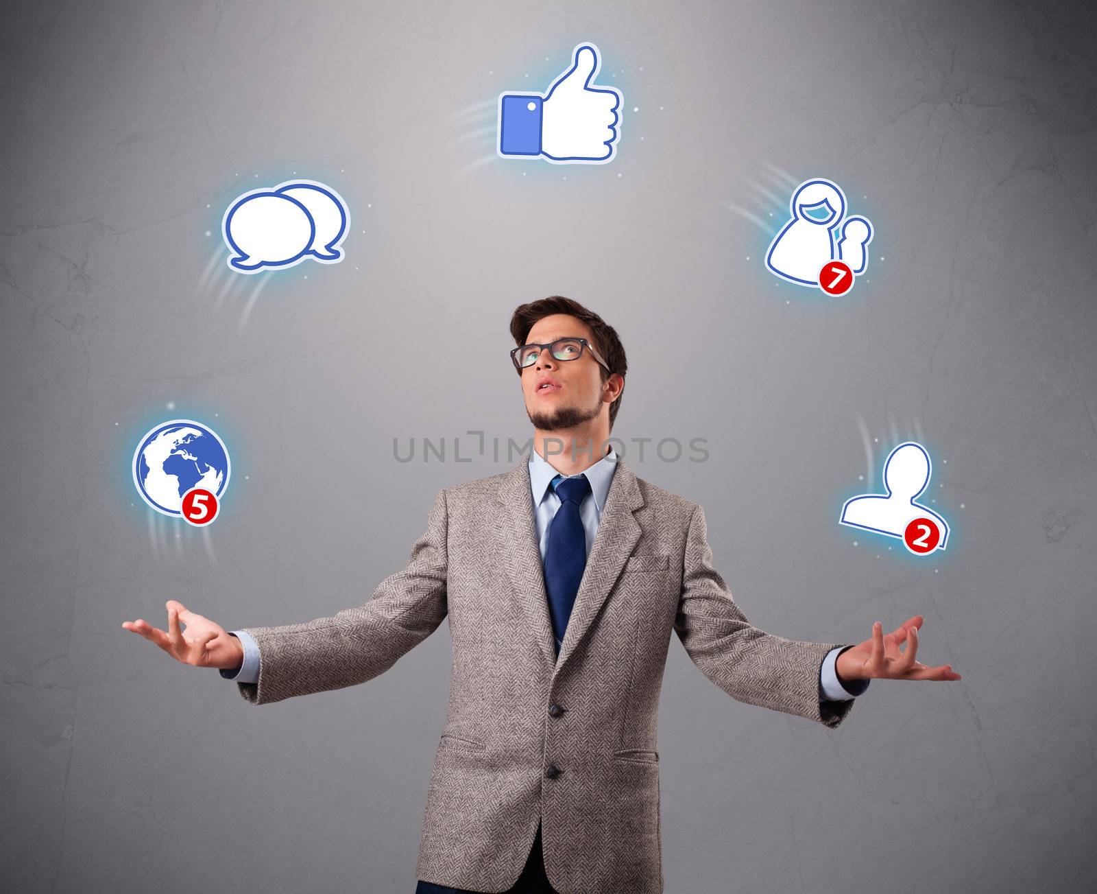 handsome boy standing and juggling with social media icons