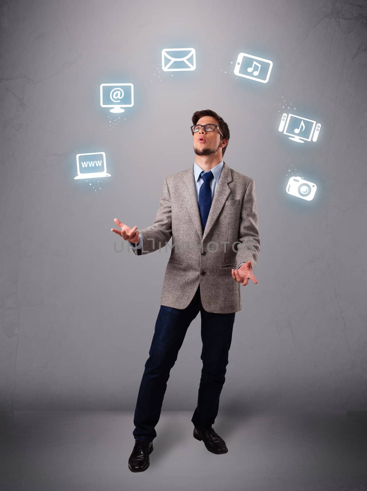 funny boy standing and juggling with electronic devices icons