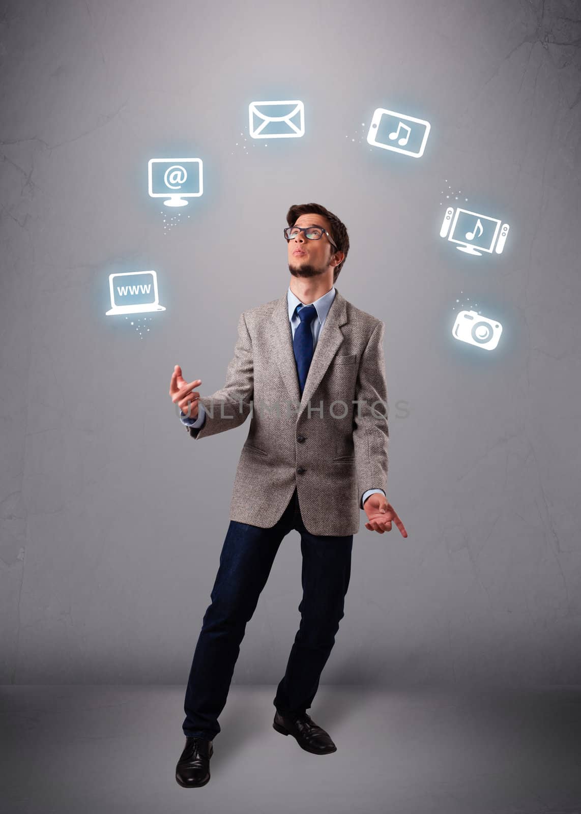 funny boy standing and juggling with electronic devices icons