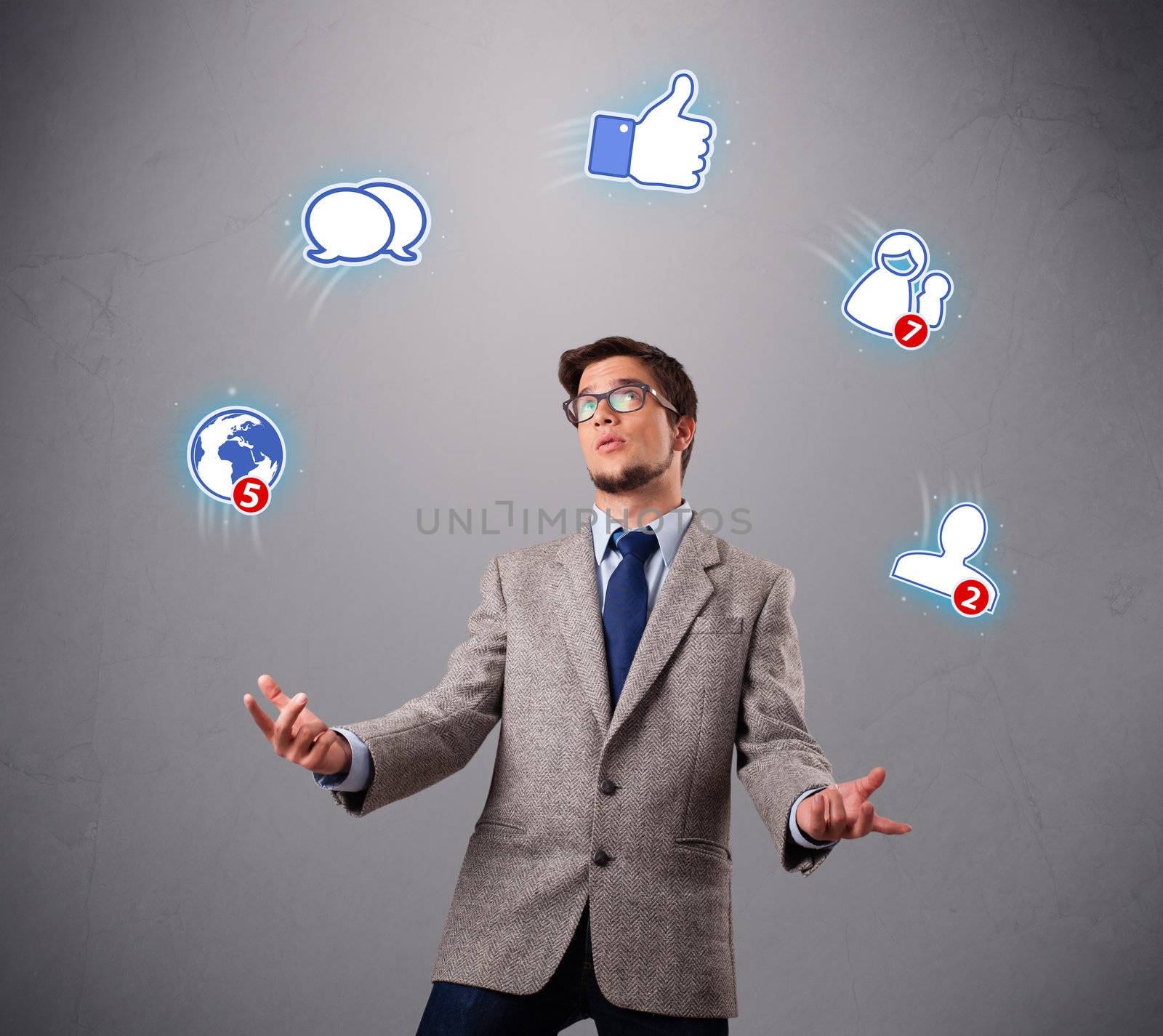 handsome boy standing and juggling with social media icons