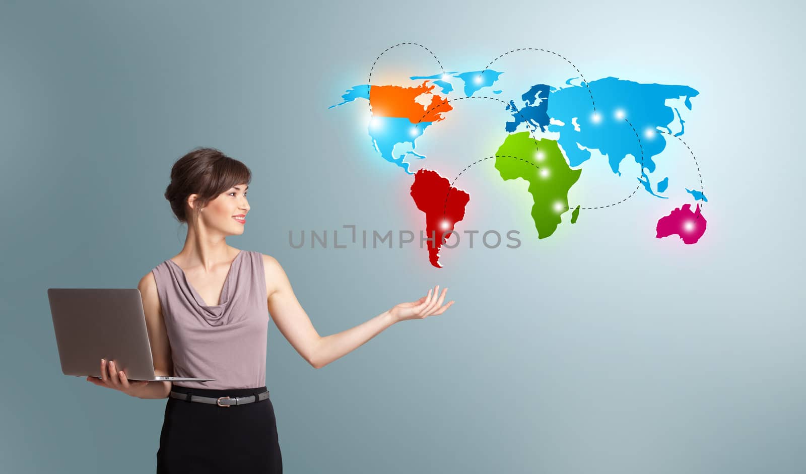 Young woman holding a laptop and presenting colorful world map by ra2studio